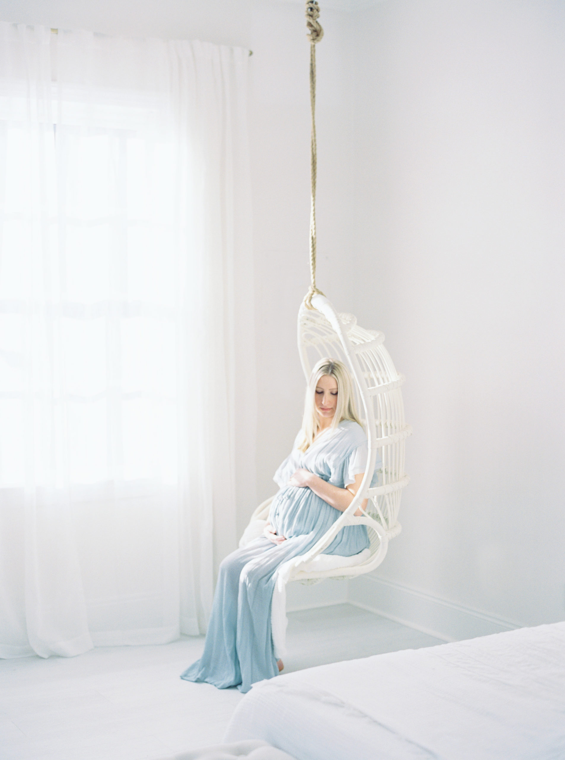 Momma cradles her baby bump during her Atlanta Studio maternity session