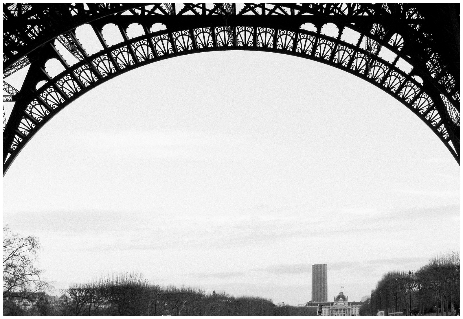 view of Tour Montparnasse from under Eiffel Tower, Paris, France